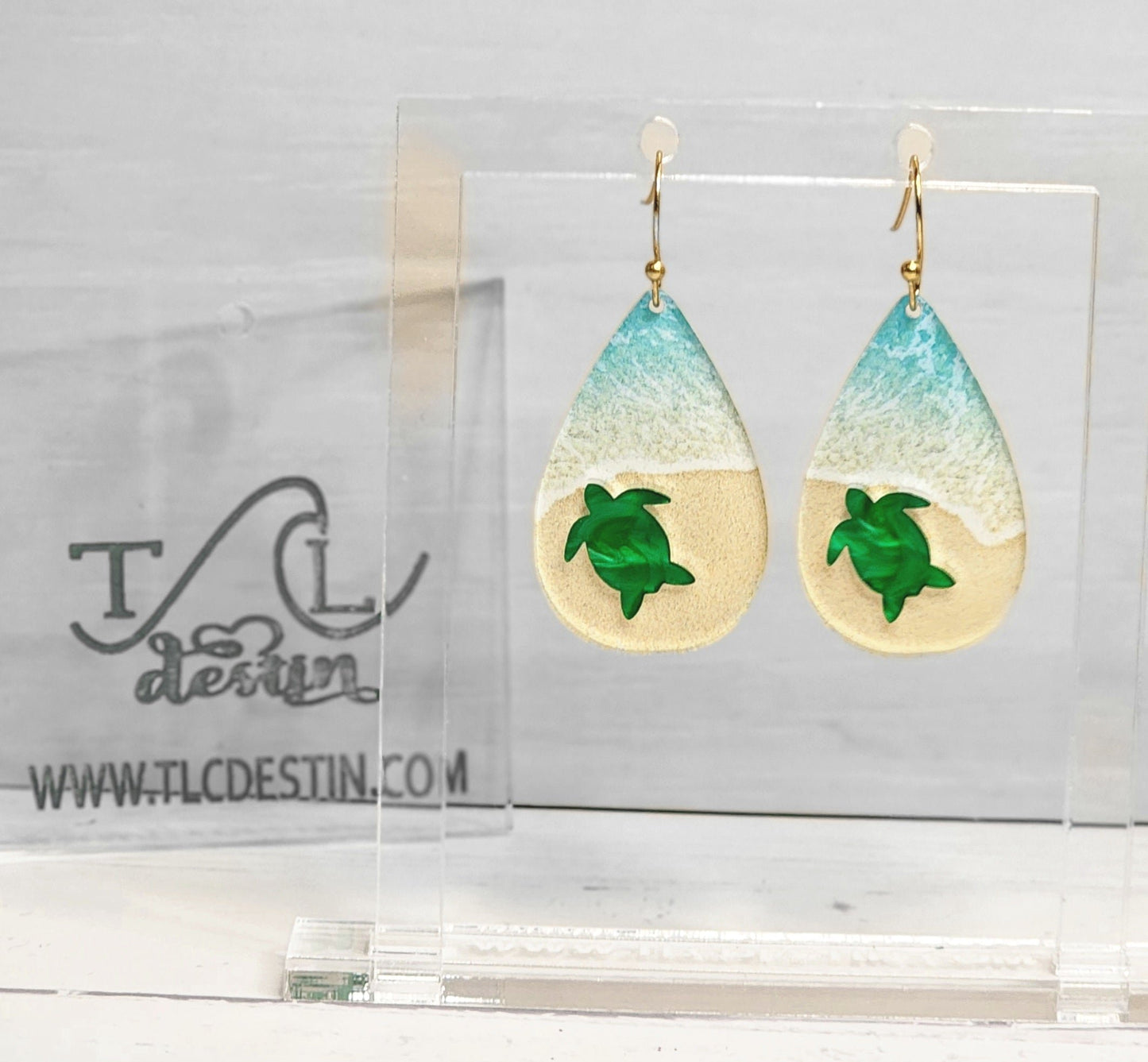Incredible 1/8 beach acrylic paired with pearl inlay turtle. Unique classic beachy earrings. Choose from stainless steel or gold plated ear hooks.