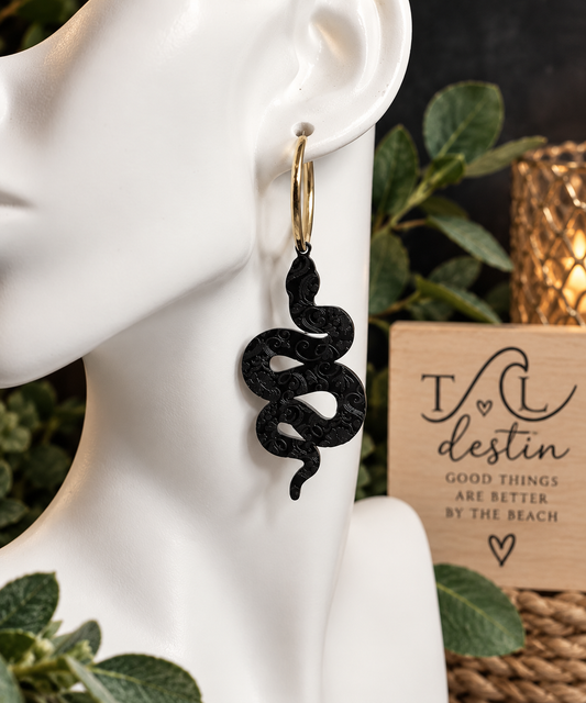 Black floral snake earrings
