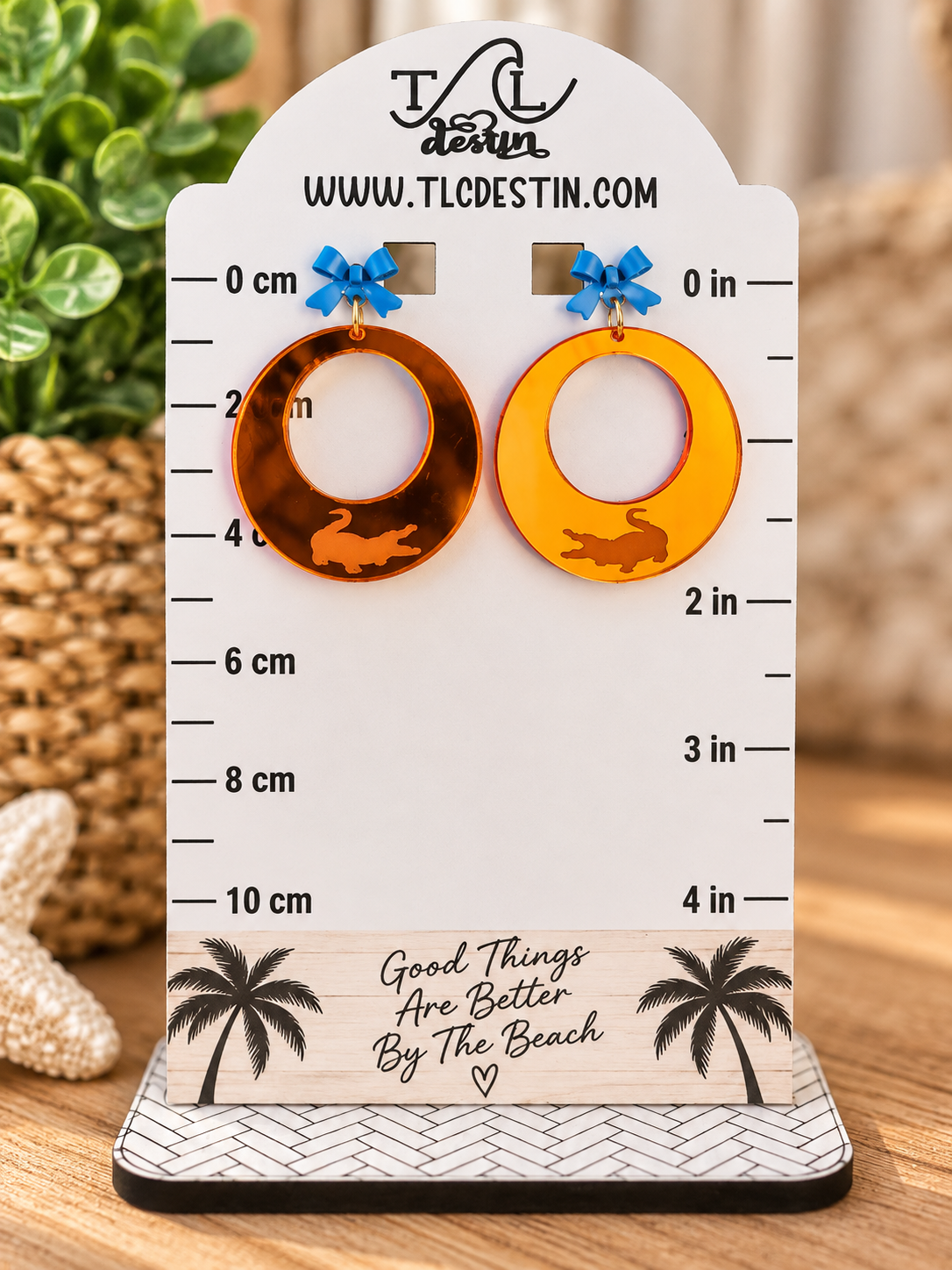 Orange mirrored Gator earrings.