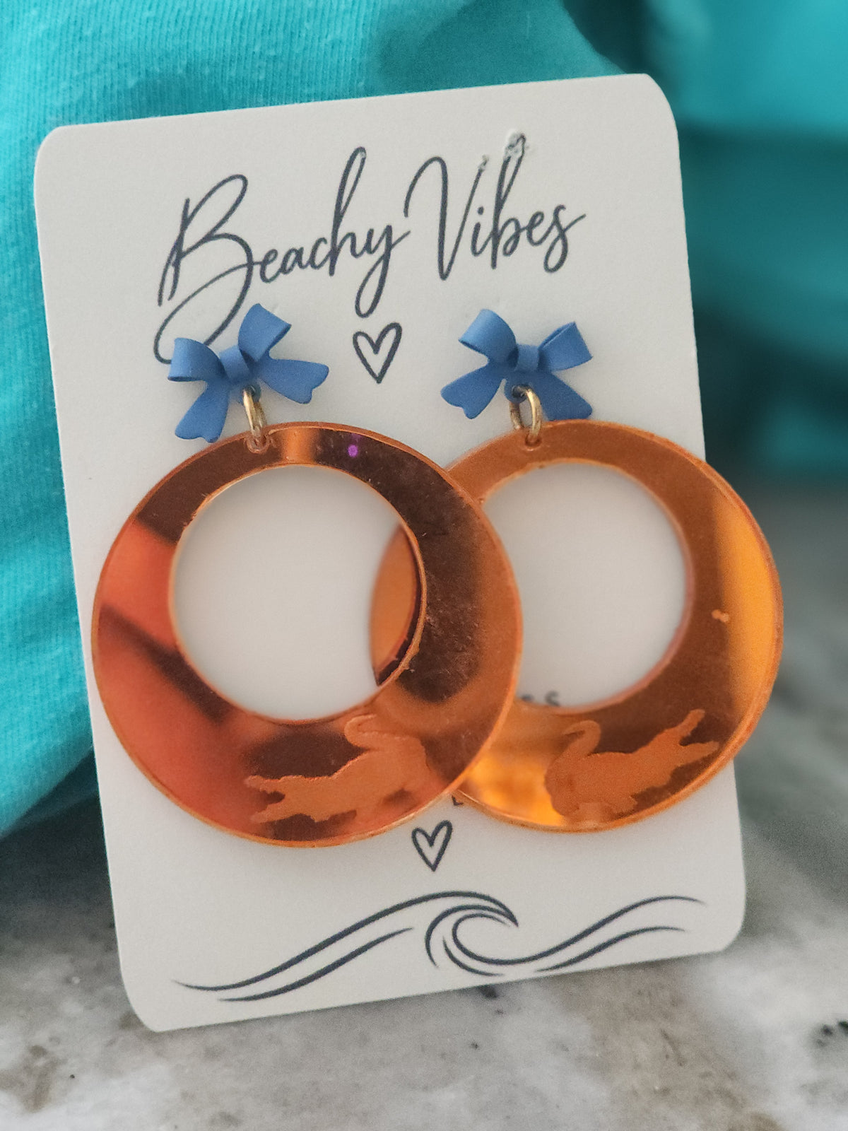 Orange mirrored Gator earrings.
