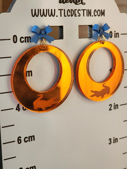 Orange mirrored Gator earrings.